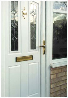 typical house exterior front door showing handle and letterbox